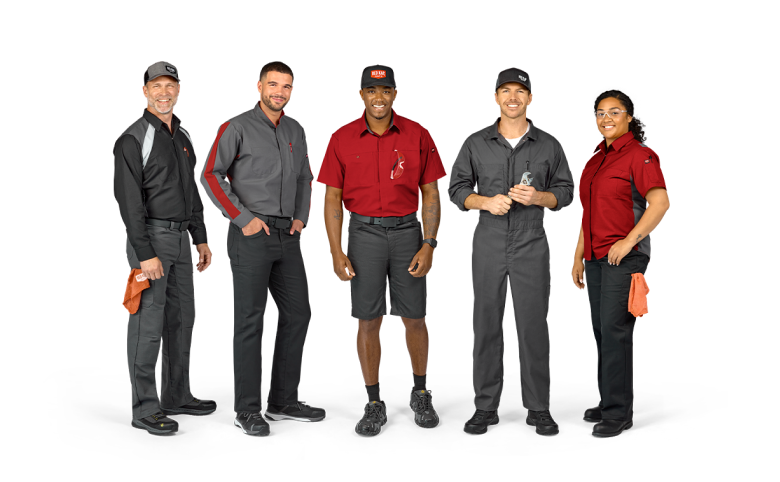 a group of happy automive workers wearing Red Kap work shirts and pants