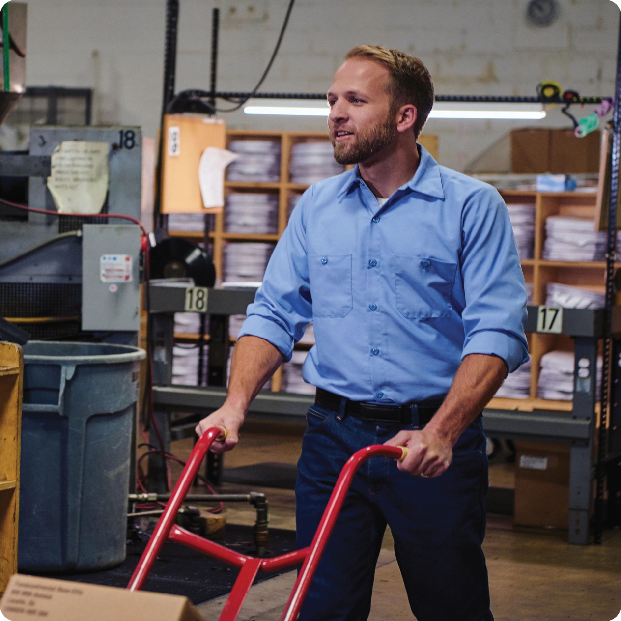 man in a warehouse wearing red kap workwear